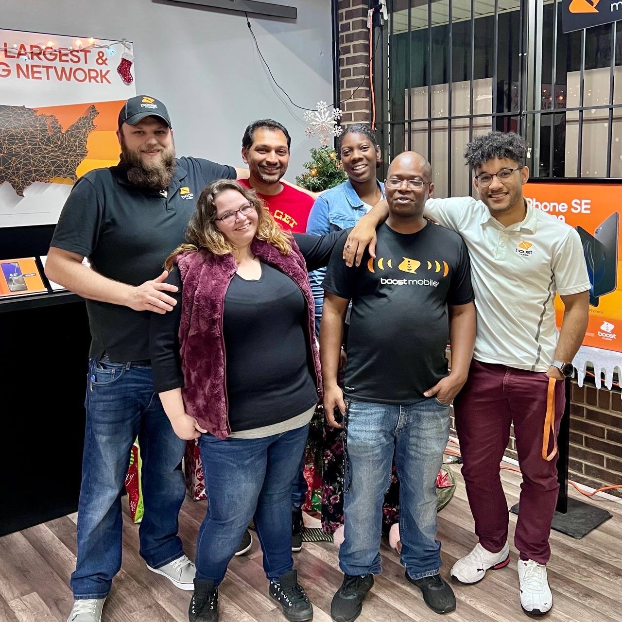 The RBFC team together inside a Boost Mobile store
