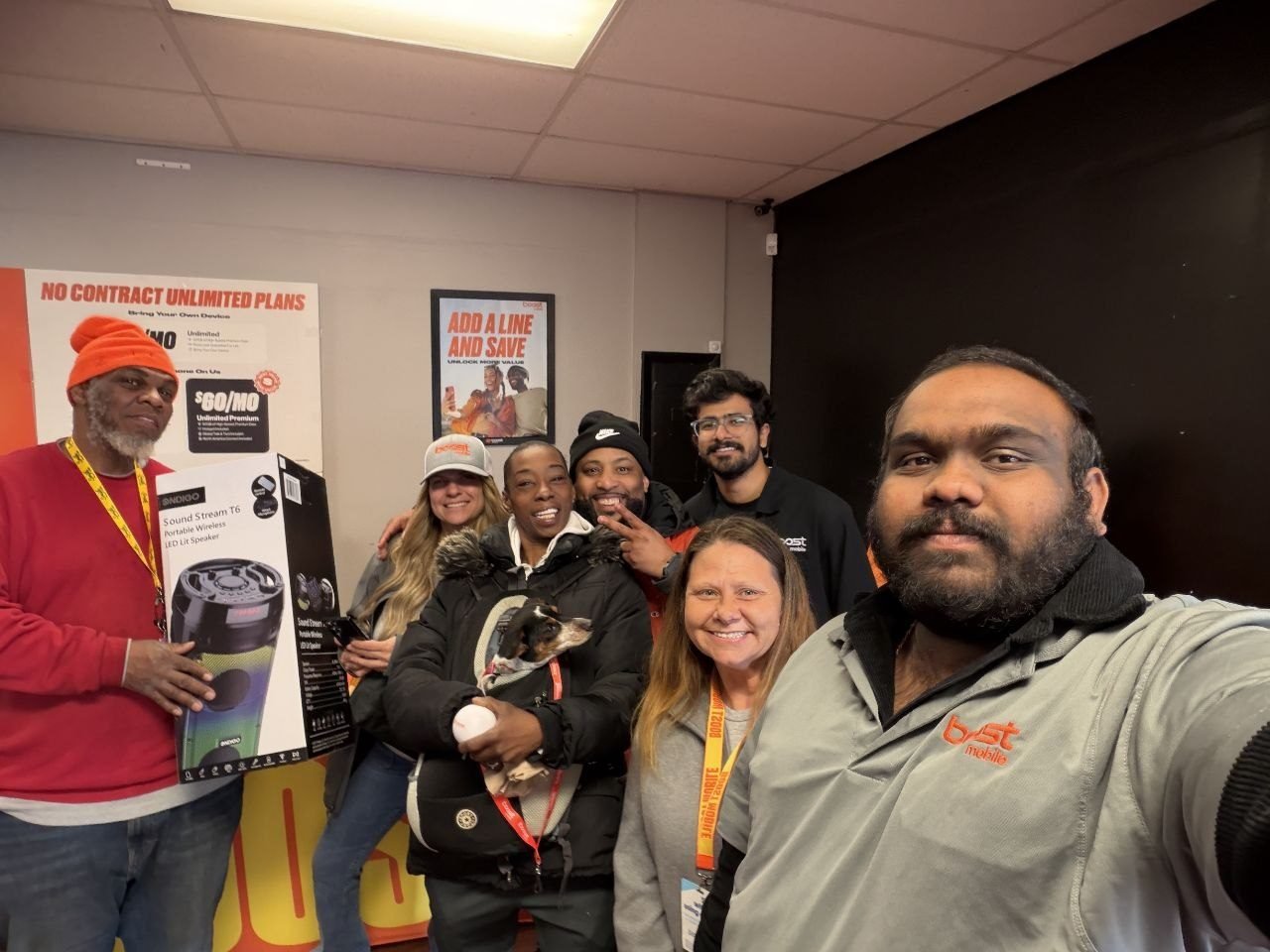 The RBFC team with customers and their prizes inside the store