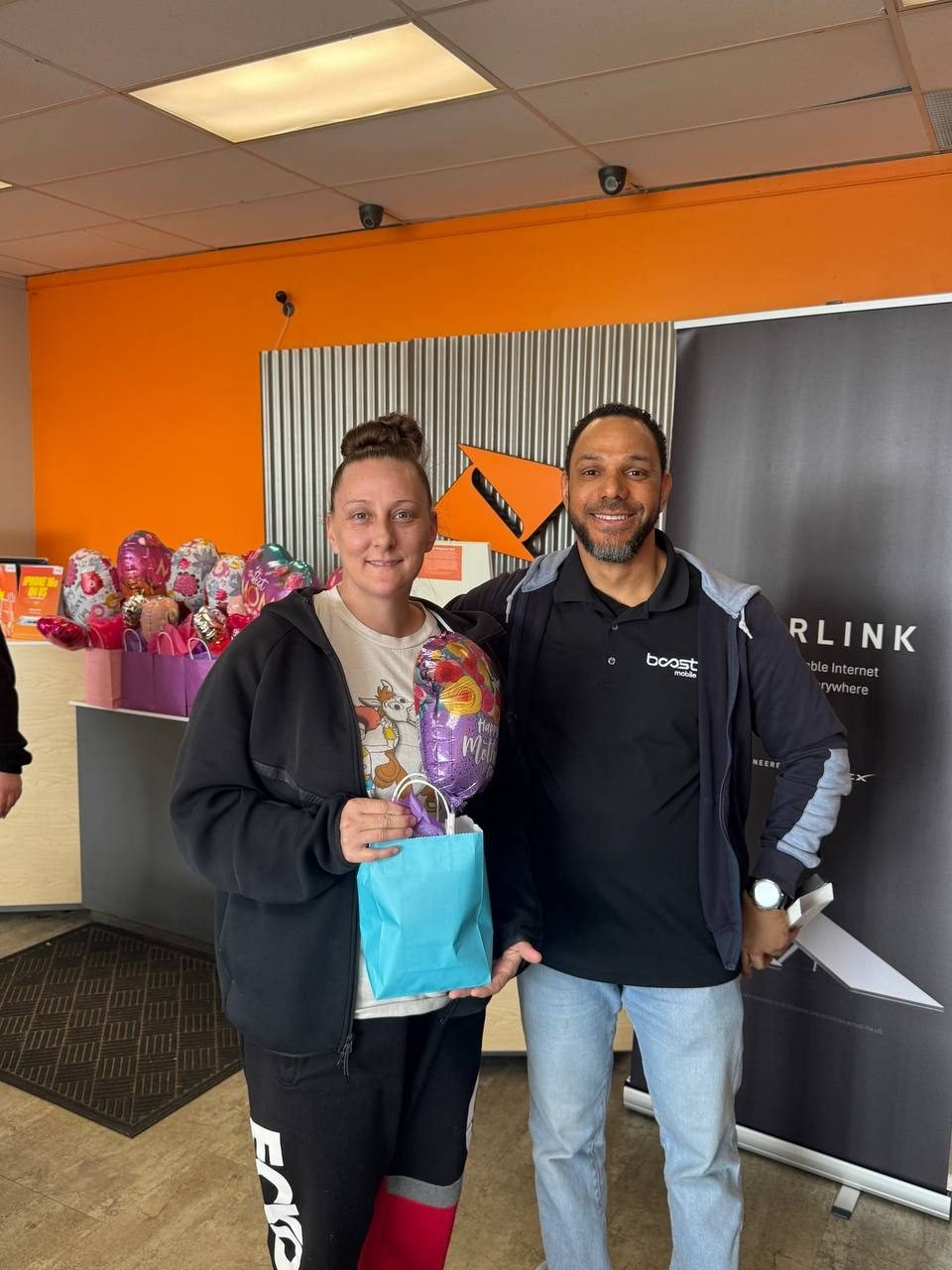 A customer receiving a Valentine's gift from an RBFC associate